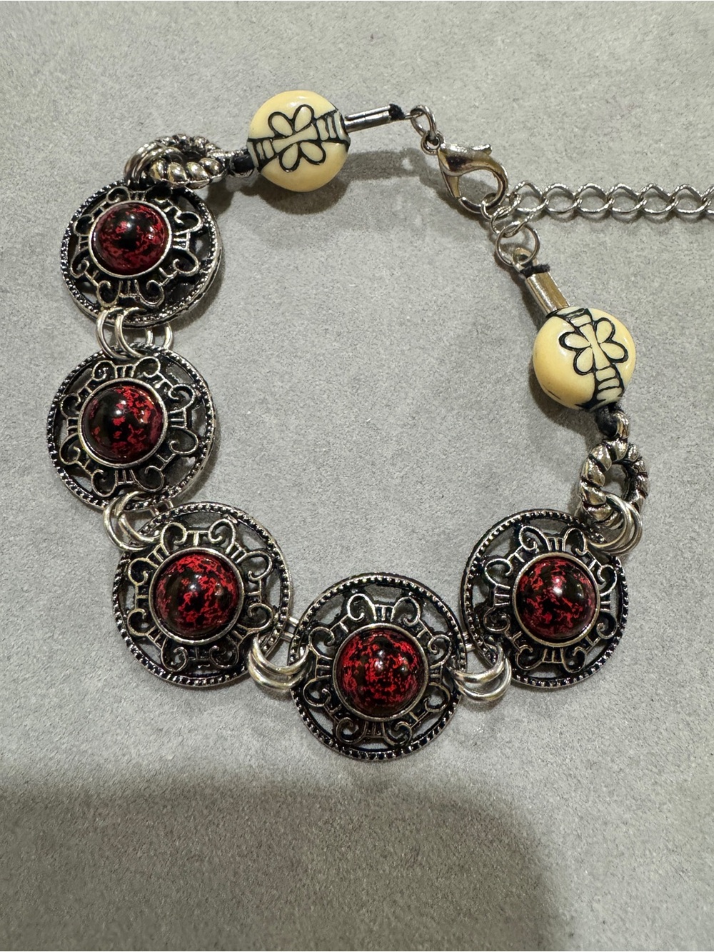Bracelet with Red Speckled Cabochons and Cream Accent Beads